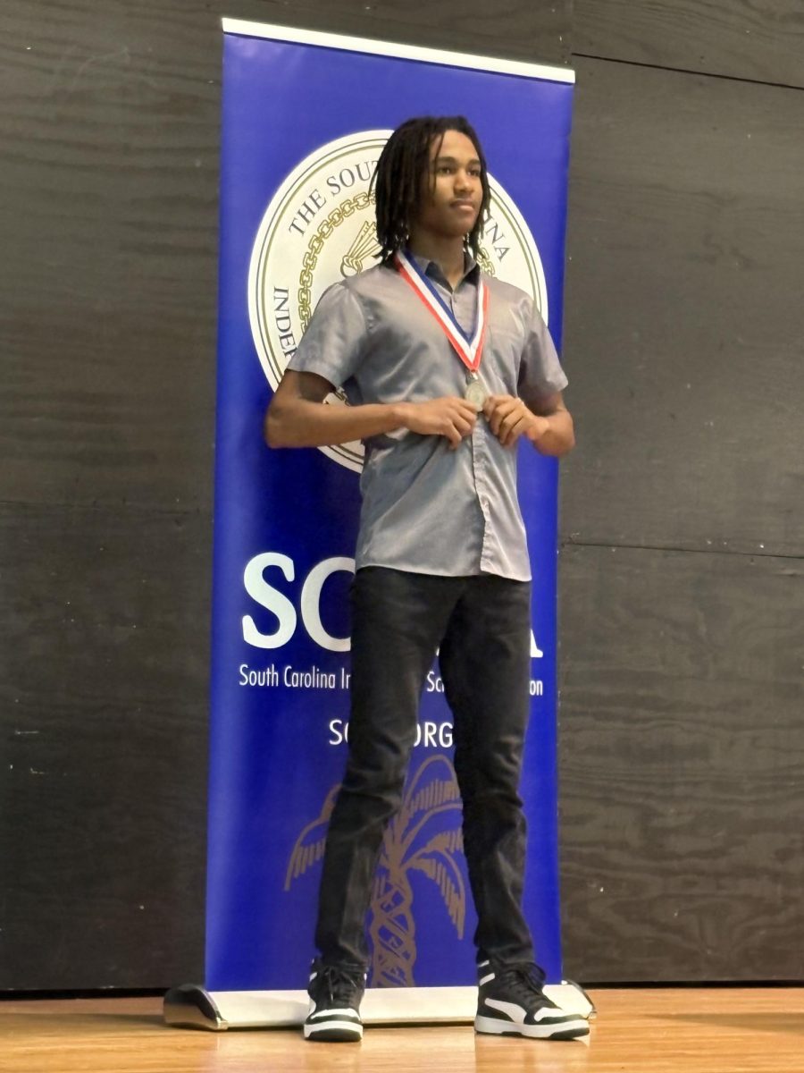 Shiloh is awarded the third place medal in the oral interpretation category. 
